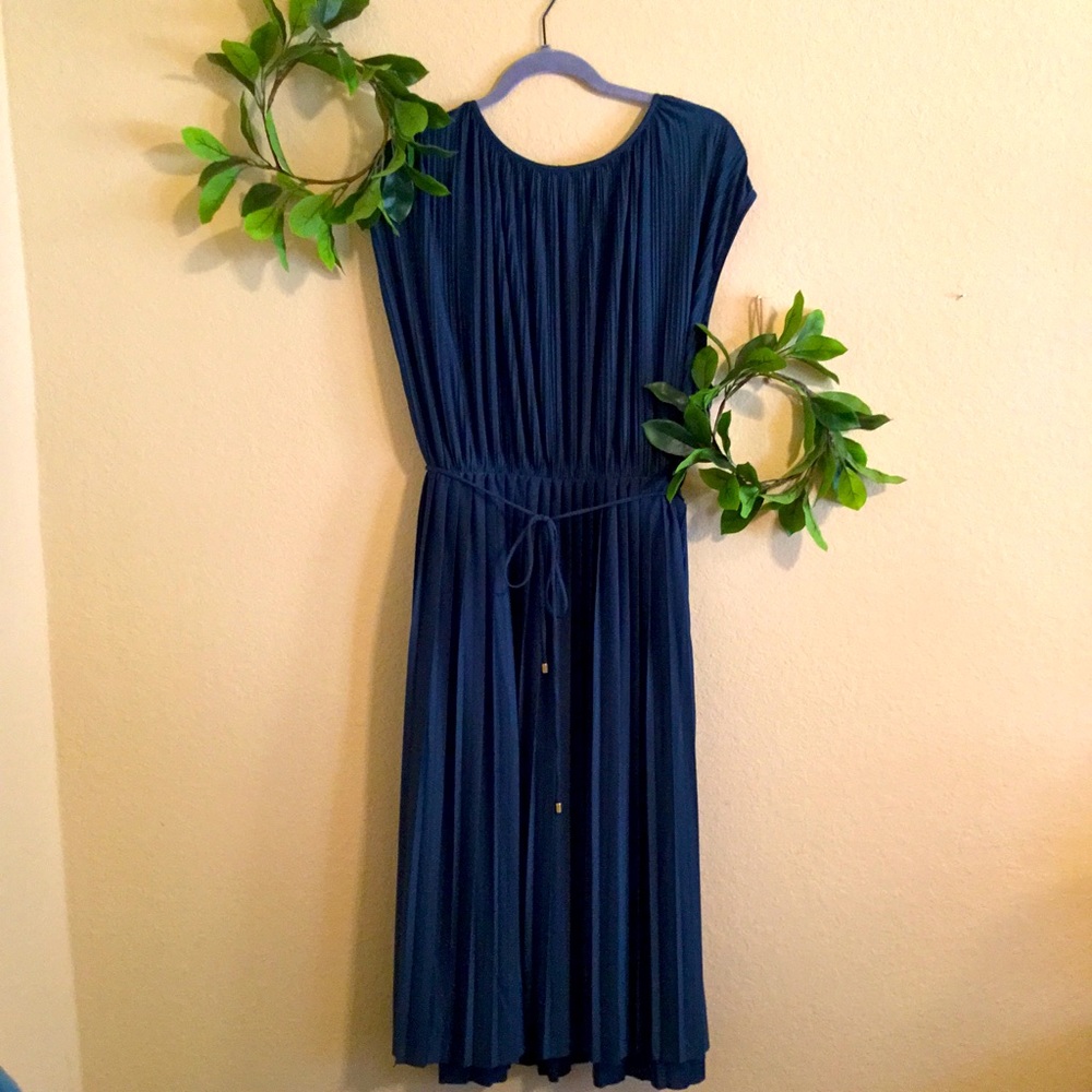 Dark teal. Formal dress.Worn once. Beautiful, semi silky material.Pleated style.